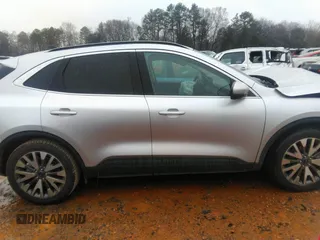2020 Ford Escape Titanium Hybrid with VIN 1FMCU0DZ8LUB13911, listed as a IAAI auction lot 41249498 with 64,108 mi miles and . Bid and sale history available at DreamBid. Image 13.