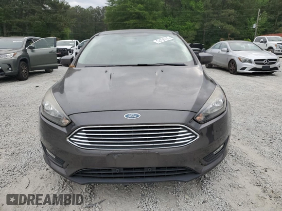 2018 Ford Focus SE z VIN 1FADP3FE1JL220741, wystawiony jako Copart lot #53755735 z przebiegiem Nie podano mil oraz Czysty tytuł • Clean title. Historia ofert i sprzedaży dostępna na DreamBid. Obrazek 5.