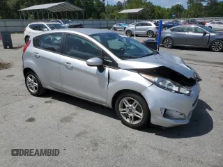 2019 Ford Fiesta SE z VIN 3FADP4EJ2KM142992, wystawiony jako Copart lot #55204795 z przebiegiem 98 018 mil mil oraz Szkody całkowita. Historia ofert i sprzedaży dostępna na DreamBid. Obrazek 4.