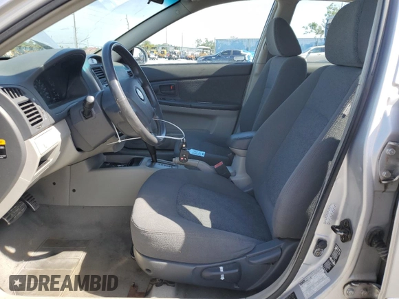 2005 Kia Spectra with VIN KNAFE162155081155, listed as a Copart auction lot 53893255 with 127,937 mi miles and Salvage Title. Bid and sale history available at carsss.com. Image 7.
