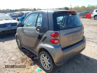 2009 Smart fortwo Pure z VIN WMEEJ31X99K302227, wystawiony jako IAAI lot #41900573 z przebiegiem 30 730 mil mil oraz . Historia ofert i sprzedaży dostępna na DreamBid. Obrazek 3.