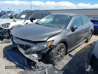 2022 Toyota Camry SE with VIN 4T1T11AKXNU683921, listed as a IAAI auction lot 41667833 with 26,578 mi miles and . Bid and sale history available at DreamBid. Image 2.