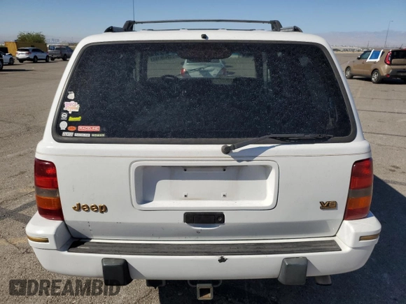1995 Jeep Grand Cherokee Limited with VIN 1J4GZ78Y3SC701103, listed as a Copart auction lot 72038184 with 143,829 mi miles and Salvage Title. Bid and sale history available at carsss.com. Image 6.