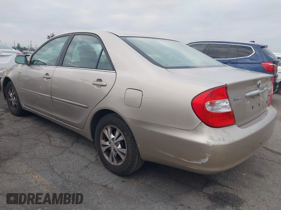 2004 Toyota Camry LE with VIN 4T1BF32K44U069081, listed as a IAAI auction lot 41460767 with 204,992 mi miles and . Bid and sale history available at carsss.com. Image 3.