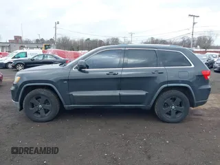 2011 Jeep Grand Cherokee Laredo with VIN 1J4RR4GGXBC597743, listed as a IAAI auction lot 41897286 with 253,111 mi miles and . Bid and sale history available at DreamBid. Image 14.