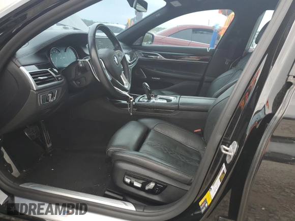 2018 BMW 7 Series 740e xDrive with VIN WBA7J2C59JB246238, listed as a Copart auction lot 53777335 with 76,642 mi miles and Salvage Title. Bid and sale history available at carsss.com. Image 7.