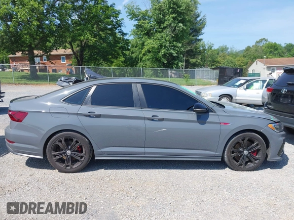 2021 Volkswagen Jetta GLI S z VIN 3VW6T7BU9MM052902, wystawiony jako IAAI lot #42286711 z przebiegiem 91 519 mil mil oraz . Historia ofert i sprzedaży dostępna na DreamBid. Obrazek 14.