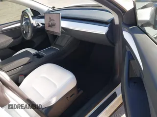 2023 Tesla Model Y Performance with VIN 7SAYGDEF2PF754938, listed as a IAAI auction lot 42067041 with 21,103 mi miles and . Bid and sale history available at DreamBid. Image 5.