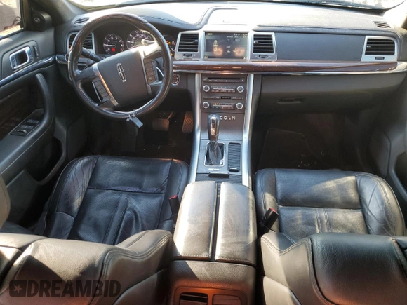2012 Lincoln MKS with VIN 1LNHL9ER2CG802577, listed as a Copart auction lot 85455164 with 121,169 mi miles and Salvage Title. Bid and sale history available at DreamBid. Image 8.