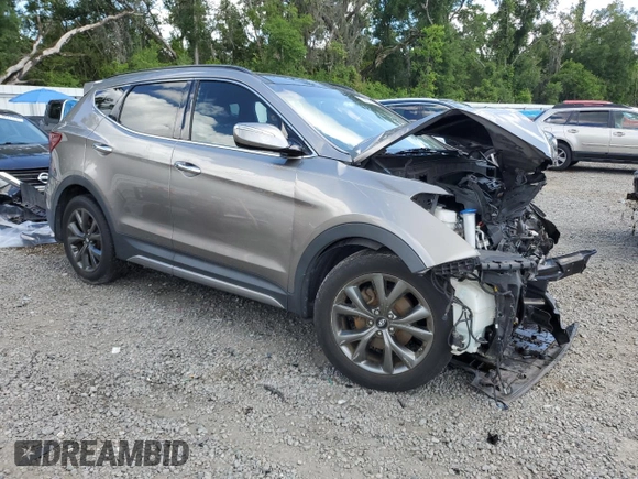 2017 Hyundai Santa Fe Ultimate z VIN 5XYZW4LA8HG491652, wystawiony jako Copart lot #56907985 z przebiegiem Nie podano mil oraz Szkoda całkowita • Salvage title. Historia ofert i sprzedaży dostępna na DreamBid. Obrazek 4.
