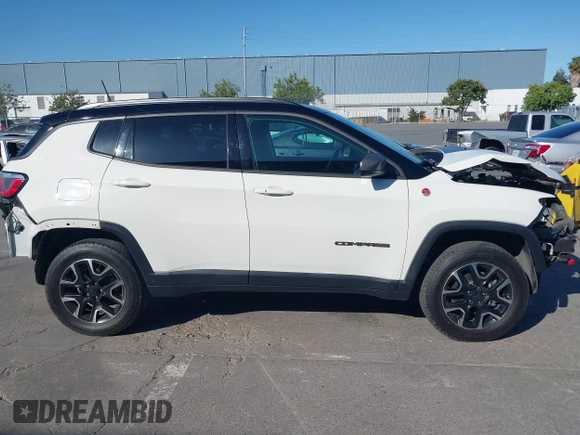 2020 Jeep Compass Trailhawk with VIN 3C4NJDDB4LT144129, listed as a IAAI auction lot 42582688 with 67,112 mi miles and . Bid and sale history available at DreamBid. Image 14.