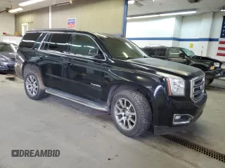 2015 GMC Yukon SLE with VIN 1GKS2AKC6FR229744, listed as a Copart auction lot 88270295 with 215,762 mi miles and Salvage Title. Bid and sale history available at DreamBid. Image 4.