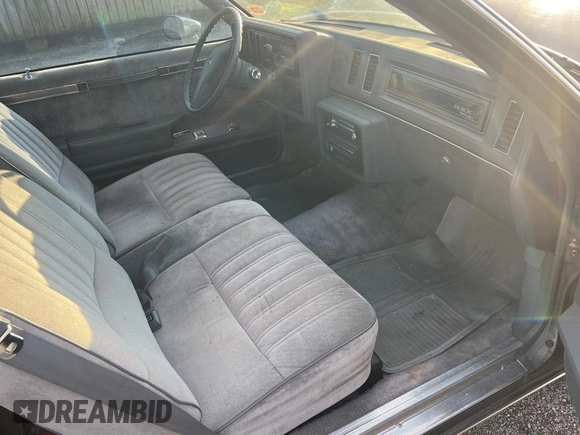 1987 Buick Regal with VIN 1G4GJ11Y4HP413978, listed as a Copart auction lot 87311954 with 52,519 mi miles and Salvage Title. Bid and sale history available at DreamBid. Image 5.