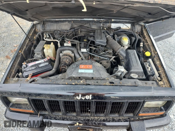1999 Jeep Cherokee z VIN 1J4FF28P4XL560533, wystawiony jako Copart lot #59180605 z przebiegiem 190 262 mil mil oraz Czysty tytuł • Clean title. Historia ofert i sprzedaży dostępna na DreamBid. Obrazek 11.