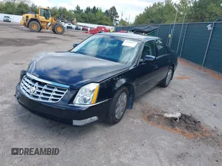 2009 Cadillac DTS 1SC z VIN 1G6KD57Y29U141800, wystawiony jako IAAI lot #42190874 z przebiegiem 115 043 mil mil oraz . Historia ofert i sprzedaży dostępna na DreamBid. Obrazek 2.