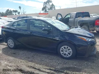 2022 Toyota Prius L Eco with VIN JTDKAMFUXN3163364, listed as a IAAI auction lot 41593914 with 43,948 mi miles. Bid and sale history available at carsss.com. Image 13.