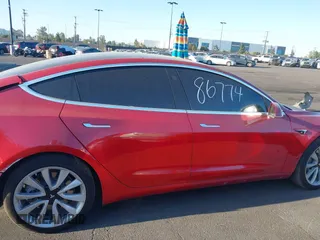 2018 Tesla Model 3 Long Range Battery with VIN 5YJ3E1EA3JF035785, listed as a IAAI auction lot 41986774 with 33,965 mi miles and . Bid and sale history available at DreamBid. Image 13.