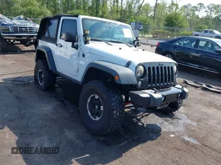 2015 Jeep Wrangler Sport z VIN 1C4AJWAG9FL747006, wystawiony jako IAAI lot #42303813 z przebiegiem 110 194 mil mil oraz . Historia ofert i sprzedaży dostępna na DreamBid. Obrazek 1.