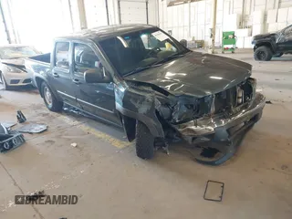 2007 Chevrolet Colorado 1LT z VIN 1GCDT13E378195495, wystawiony jako IAAI lot #42185021 z przebiegiem 142 295 mil mil oraz . Historia ofert i sprzedaży dostępna na DreamBid. Obrazek 1.