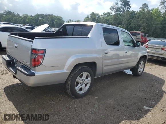2014 Honda Ridgeline RTL with VIN 5FPYK1F58EB012869, listed as a Copart auction lot 51854995 with 318,950 mi miles and Salvage title. Bid and sale history available at DreamBid. Image 3.