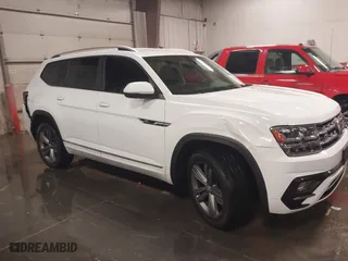 2019 Volkswagen Atlas 3.6L V6 SE w/Technology R-Line with VIN 1V2XR2CA3KC557800, listed as a IAAI auction lot 41246957 with 128,358 mi miles. Bid and sale history available at carsss.com. Image 1.
