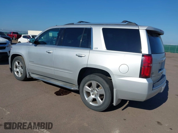 2015 Chevrolet Tahoe LTZ with VIN 1GNSKCKC5FR205739, listed as a IAAI auction lot 40020644 with 142,524 mi miles and . Bid and sale history available at DreamBid. Image 3.