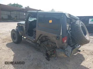 2014 Jeep Wrangler Sport with VIN 1C4AJWAGXEL233647, listed as a IAAI auction lot 39993785 with Not Provided miles and . Bid and sale history available at DreamBid. Image 3.