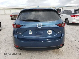 2019 Mazda CX-5 Grand Touring with VIN JM3KFADM1K1600329, listed as a Copart auction lot 51807165 with 51,579 mi miles and Salvage Title. Bid and sale history available at carsss.com. Image 6.