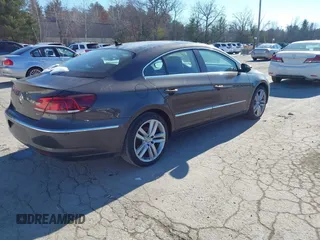 2013 Volkswagen CC Lux with VIN WVWRP7ANXDE522469, listed as a IAAI auction lot 41413025 with 115,117 mi miles. Bid and sale history available at carsss.com. Image 4.