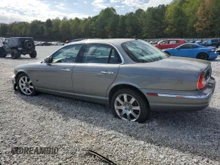 2006 Jaguar XJ with VIN SAJWA71B06SH03941, listed as a Copart auction lot 76013984 with 0 mi miles and Salvage Title. Bid and sale history available at carsss.com. Image 2.
