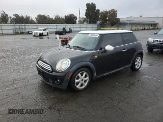 2010 MINI Hardtop with VIN WMWMF3C59ATZ24863, listed as a Copart auction lot 49006655 with 103,645 mi miles and Salvage Title. Bid and sale history available at DreamBid. Image 1.