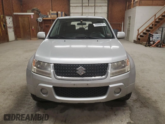 2012 Suzuki Grand Vitara Premium z VIN JS3TD0D2XC4100425, wystawiony jako Copart lot #49080815 z przebiegiem 108 780 mil mil oraz Szkody całkowita. Historia ofert i sprzedaży dostępna na DreamBid. Obrazek 5.