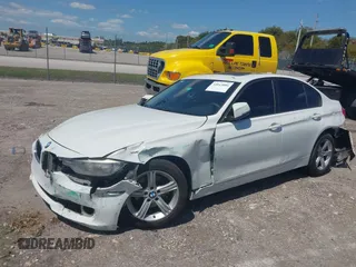 2014 BMW 3 Series 320i with VIN WBA3B1C51EK131063, listed as a IAAI auction lot 42043086 with 92,306 mi miles. Bid and sale history available at carsss.com. Image 17.