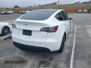 2020 Tesla Model Y Long Range with VIN 5YJYGDEE2LF022484, listed as a IAAI auction lot 41798662 with 108,978 mi miles and . Bid and sale history available at DreamBid. Image 4.