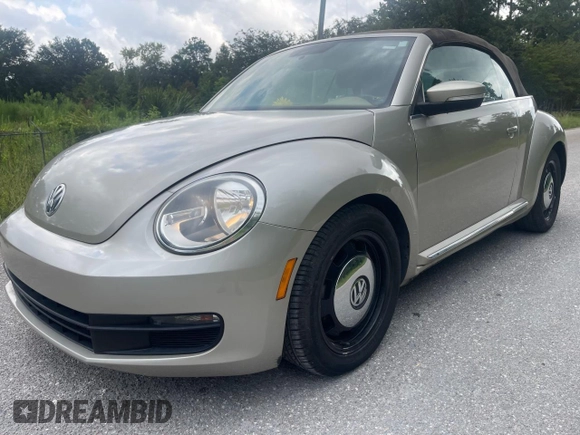2013 Volkswagen Beetle 2.5L with VIN 3VW5X7AT2DM825928, listed as a Copart auction lot 66500855 with 48,795 mi miles and Salvage title. Bid and sale history available at DreamBid. Image 2.