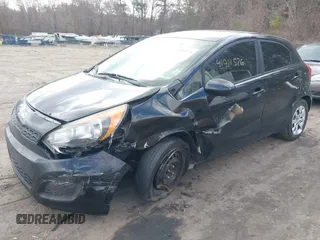 2014 Kia Rio LX with VIN KNADM5A33E6359792, listed as a IAAI auction lot 41911576 with 182,829 mi miles. Bid and sale history available at carsss.com. Image 2.