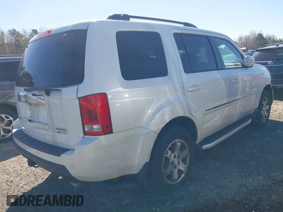 2011 Honda Pilot Touring with VIN 5FNYF4H97BB067954, listed as a IAAI auction lot 41832617 with 141,141 mi miles. Bid and sale history available at carsss.com. Image 4.