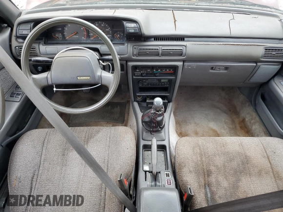 1989 Toyota Camry DLX с VIN 4T1SV21E1KU108151, выставлен на аукционе Copart как лот 73657634 с пробегом 347 186 миль миль и На запчасти • Non repairable. История ставок и продаж доступна на DreamBid. Изображение 8.