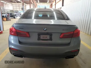 2018 BMW 5 Series M550i xDrive with VIN WBAJB9C55JB050213, listed as a Copart auction lot 61714255 with 34,700 mi miles and Salvage title. Bid and sale history available at DreamBid. Image 6.