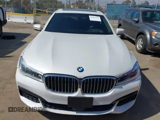 2019 BMW 7 Series 750i with VIN WBA7F0C5XKGM25771, listed as a IAAI auction lot 42167614 with 73,692 mi miles. Bid and sale history available at carsss.com. Image 6.