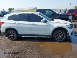 2021 BMW X1 xDrive28i with VIN WBXJG9C02M3M42379, listed as a IAAI auction lot 42476221 with 60,412 mi miles and . Bid and sale history available at DreamBid. Image 14.