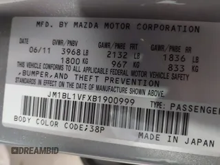 2011 Mazda Mazda3 i Touring with VIN JM1BL1VFXB1900999, listed as a IAAI auction lot 42067239 with 202,829 mi miles. Bid and sale history available at carsss.com. Image 9.