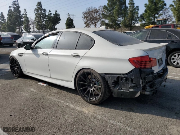 2014 BMW M5 with VIN WBSFV9C56ED097642, listed as a Copart auction lot 87054484 with 77,022 mi miles and Salvage Title. Bid and sale history available at carsss.com. Image 2.