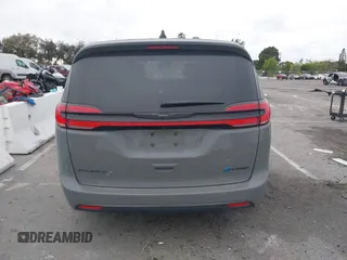 2023 Chrysler Pacifica Hybrid Touring L with VIN 2C4RC1L71PR584485, listed as a IAAI auction lot 42056423 with 58,955 mi miles and . Bid and sale history available at DreamBid. Image 17.