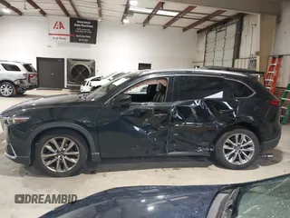 2016 Mazda CX-9 Signature z VIN JM3TCBEY5G0111286, wystawiony jako IAAI lot #42018161 z przebiegiem 155 920 mil mil oraz . Historia ofert i sprzedaży dostępna na DreamBid. Obrazek 14.