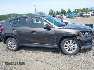 2016 Mazda CX-5 Sport with VIN JM3KE4BY8G0785812, listed as a IAAI auction lot 42324083 with 57,405 mi miles and . Bid and sale history available at DreamBid. Image 6.