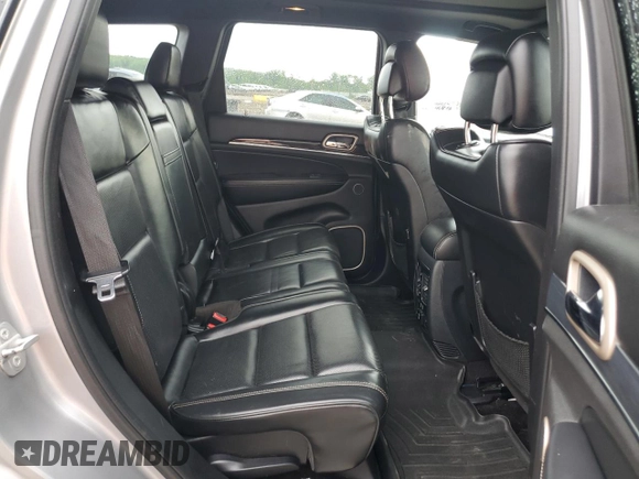 2015 Jeep Grand Cherokee High Altitude with VIN 1C4RJFCG2FC196563, listed as a Copart auction lot 56302315 with 143,759 mi miles and Salvage title. Bid and sale history available at DreamBid. Image 11.