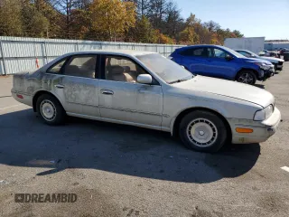 1994 Infiniti Q45 z VIN JNKNG01D3RM252218, wystawiony jako Copart lot #77230944 z przebiegiem 69 069 mil mil oraz Tytuł czysty. Historia ofert i sprzedaży dostępna na DreamBid. Obrazek 4.