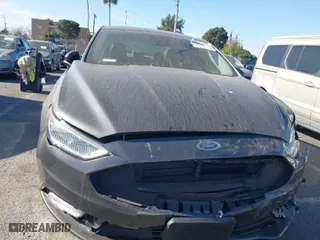 2017 Ford Fusion Energi Titanium with VIN 3FA6P0SU5HR105477, listed as a IAAI auction lot 41072696 with 92,926 mi miles. Bid and sale history available at carsss.com. Image 6.