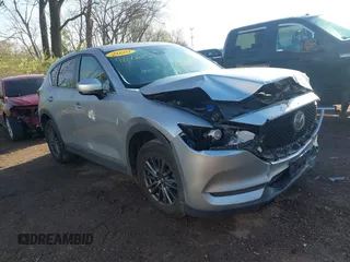 2020 Mazda CX-5 Touring with VIN JM3KFACM5L0766698, listed as a IAAI auction lot 42006157 with 80,288 mi miles and . Bid and sale history available at carsss.com. Image 1.